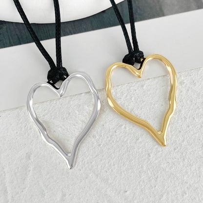 Women's Heart-shaped Hollow Pendant For Simple Geometric Ellipse Necklaces
